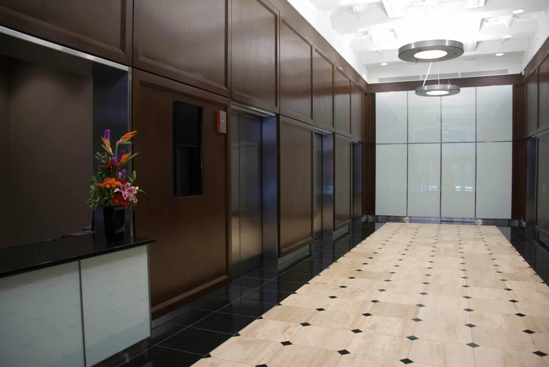 Custom Fabrication of Architectural Back Painted Glass Wall Panels for a Lobby from Construction Specialty Projects by Commercial Builder & General Contractor Structural Enterprises