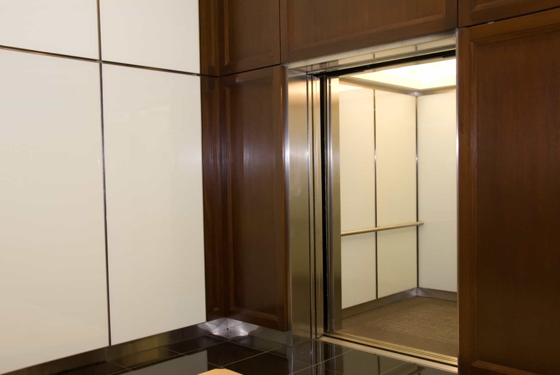 Custom Fabrication of Architectural Back Painted Glass Wall Panels for Elevators and Lobby from Construction Specialty Projects by Commercial Builder & General Contractor Structural Enterprises