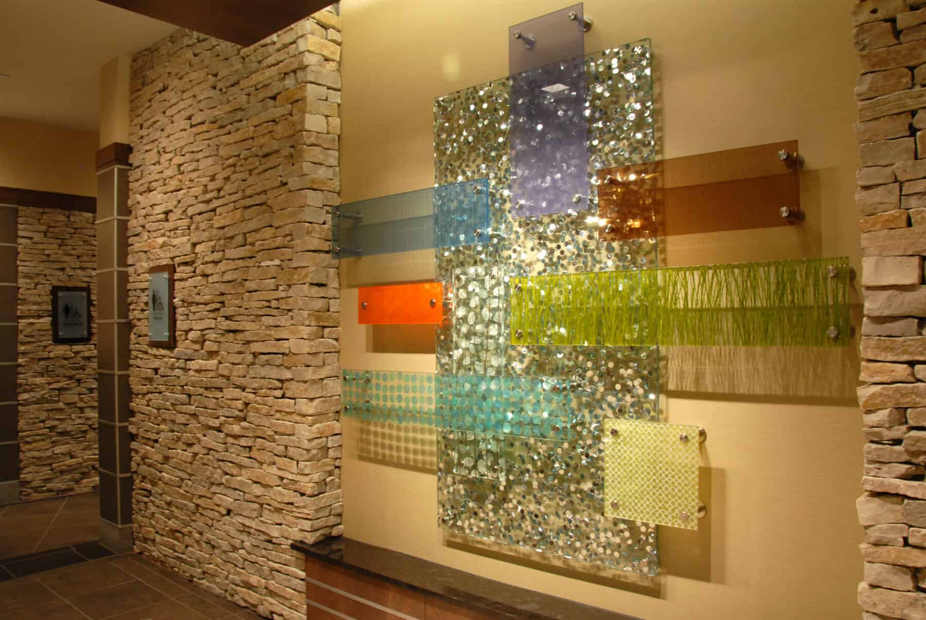 Custom Fabrication of Intricate Architectural Art Glass Panels Installed with Special Hardware for Construction Specialty Projects by Commercial Builder & General Contractor Structural Enterprises