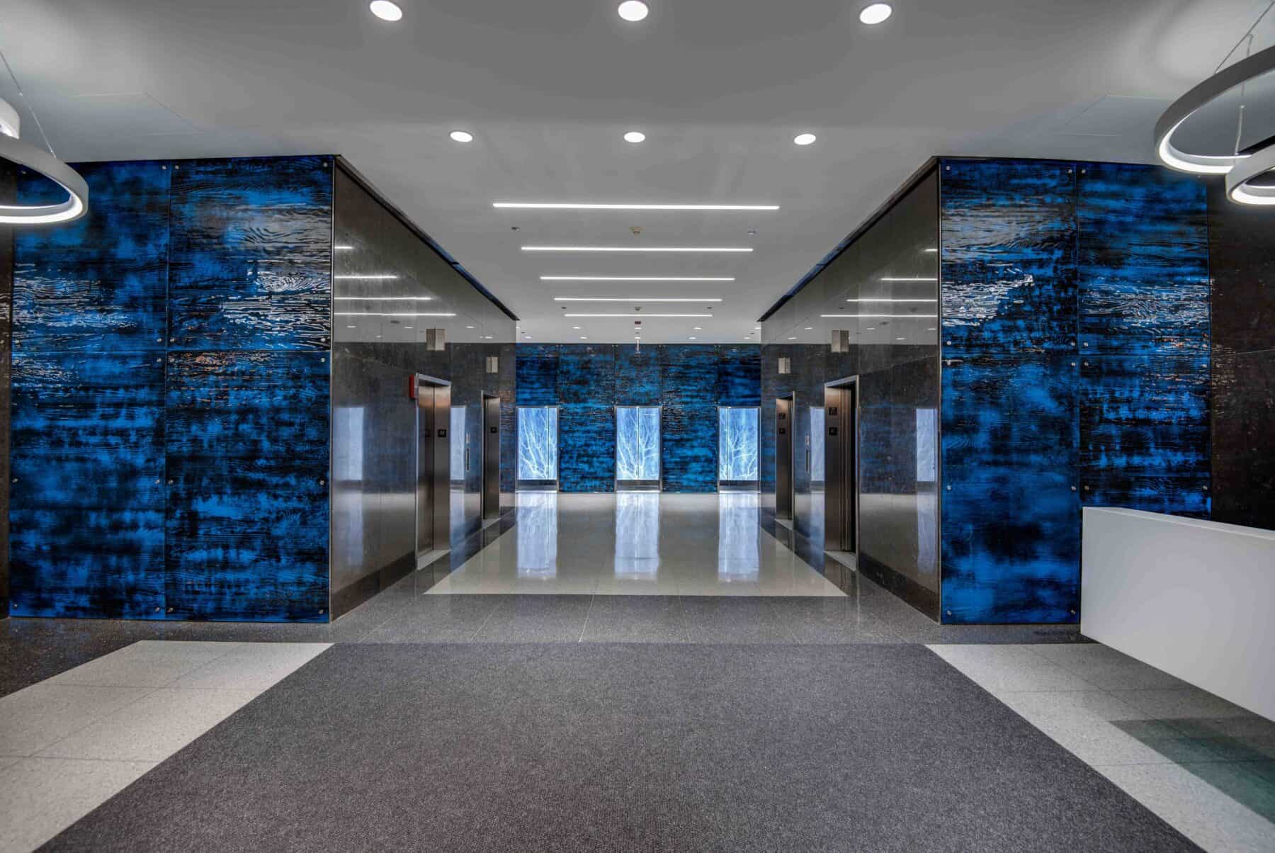 Custom Fabrication of Architectural Backlit Custom Image Glass Panels for Elevators and Textured Lobby Art Glass Panels for Construction Specialty Projects by Commercial Builder & General Contractor Structural Enterprises