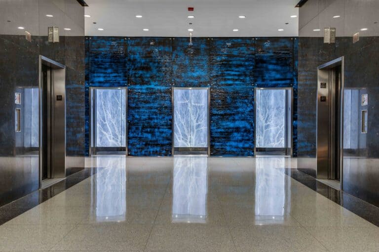 Custom Fabrication of Architectural Glass. Specialty Contractors S&E Design Build Featured Project: Art Glass Wall and Elevator Interior