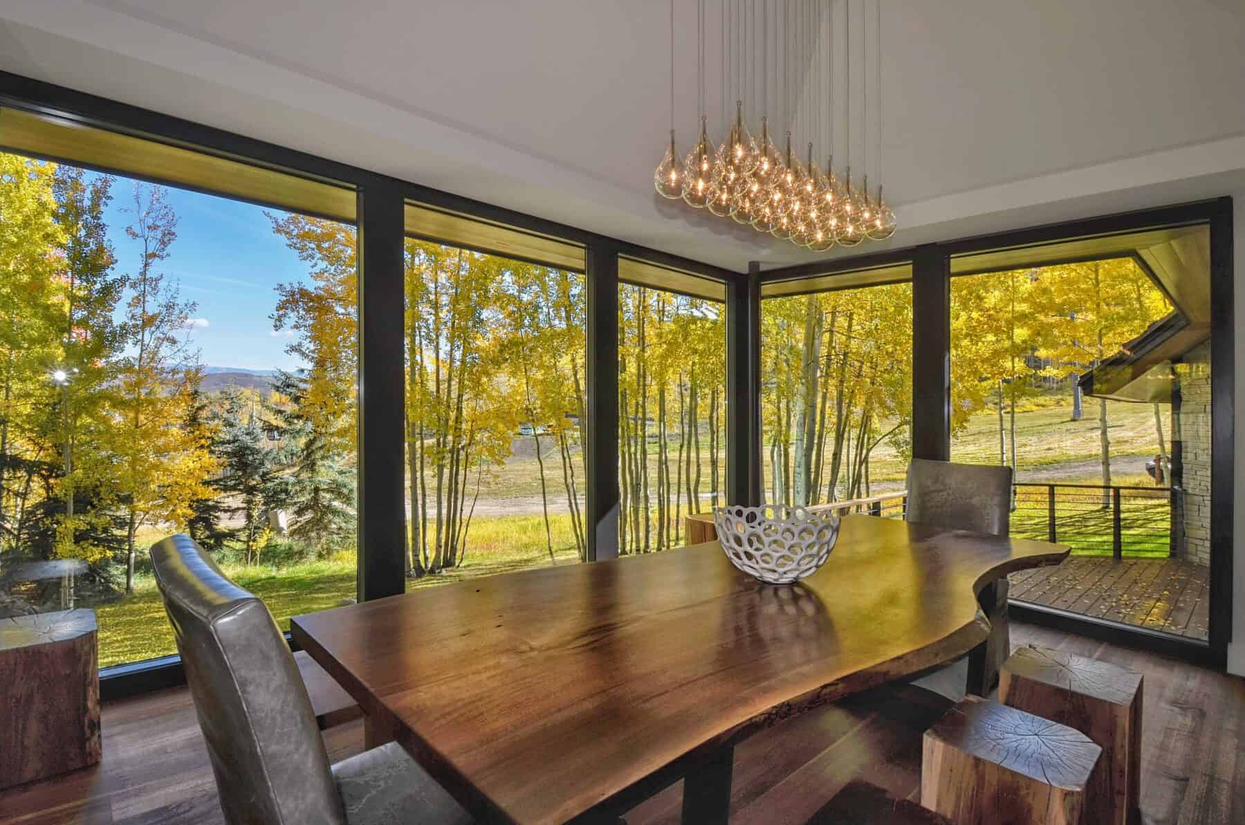 Live Edge Walnut Dining Table in Aspen, Colorado Custom Home. Luxury Home Building Interiors