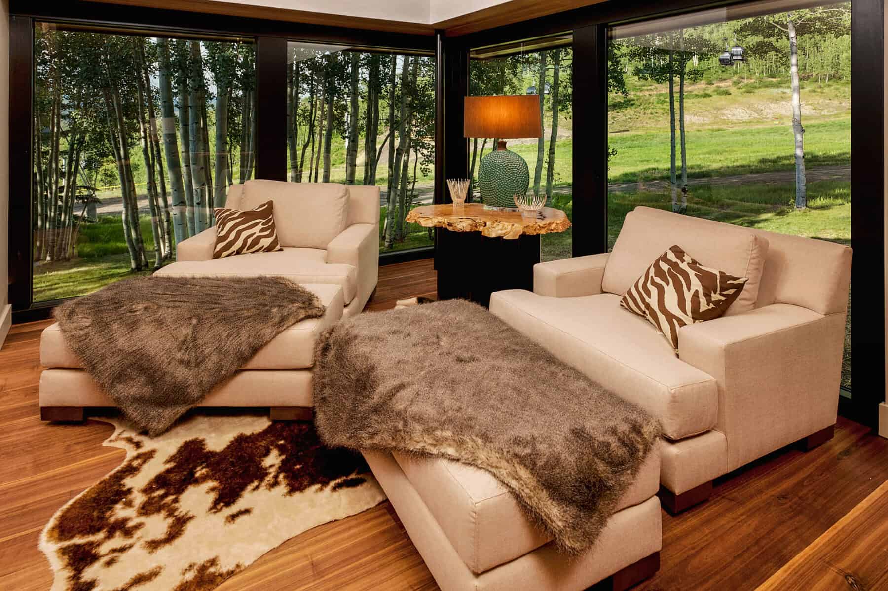 Cozy Sitting Area with Fur throws in Aspen, Colorado Custom Home. Luxury Home Building Interiors