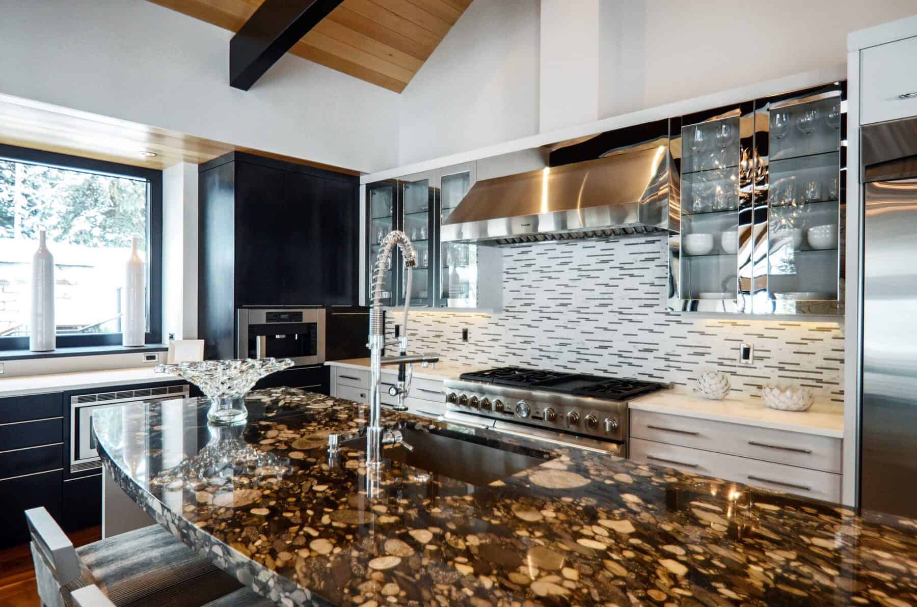 Kitchen with Marinace River Rock Island in Aspen, Colorado Custom Home. Luxury Home Building Interiors