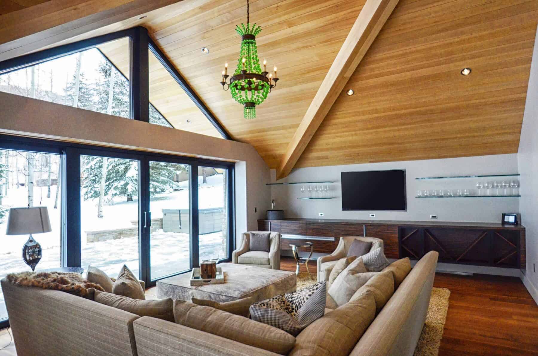 A Sitting Room with Floating Bar on Ski Slopedside in Aspen, Colorado Custom Home. Luxury Home Building Interiors