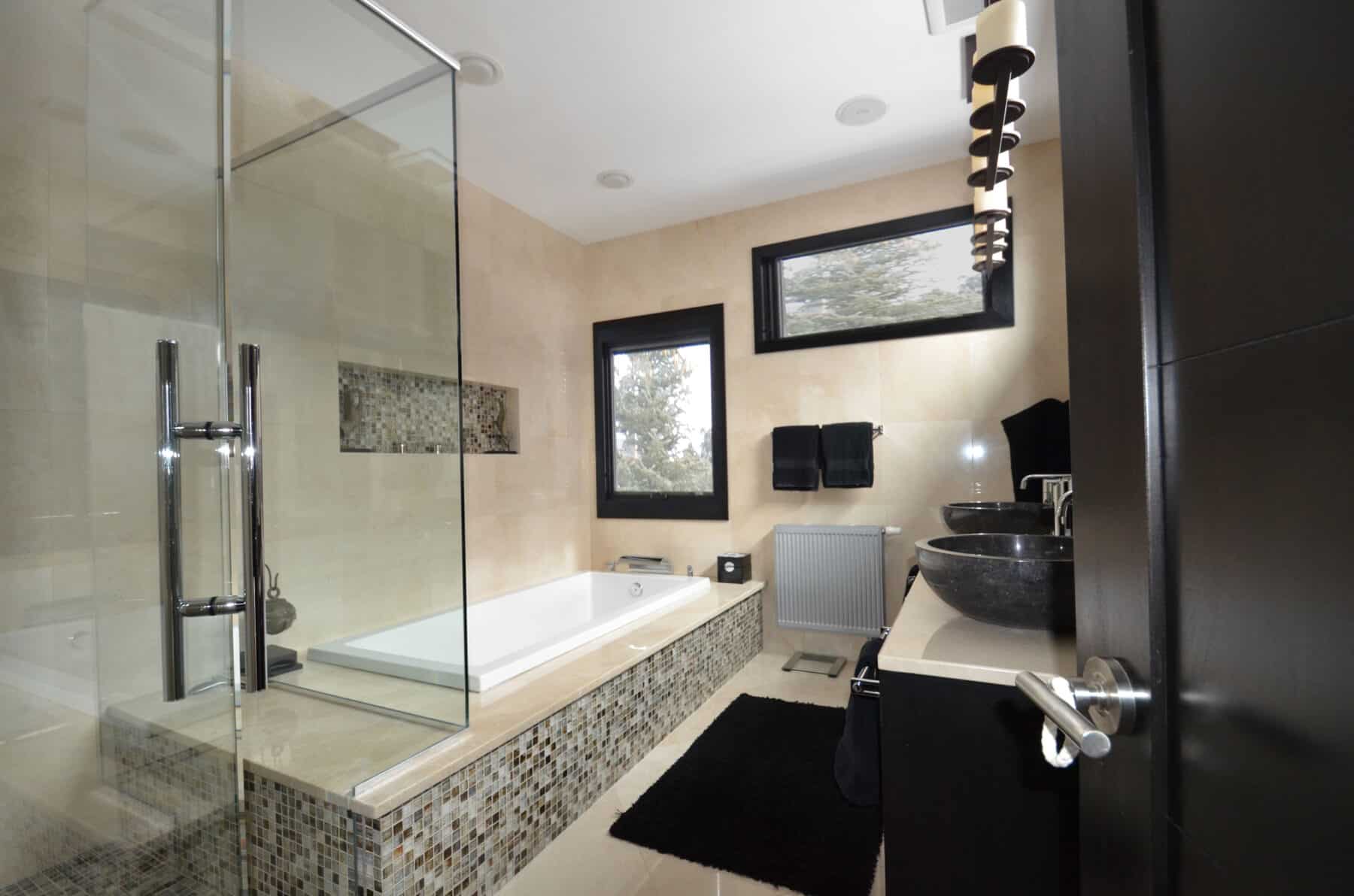 Modern Marble and Mosaic Mater Bathroom with Tub and Glass Shower in Aspen, Colorado Custom Home. Luxury Home Building Interiors
