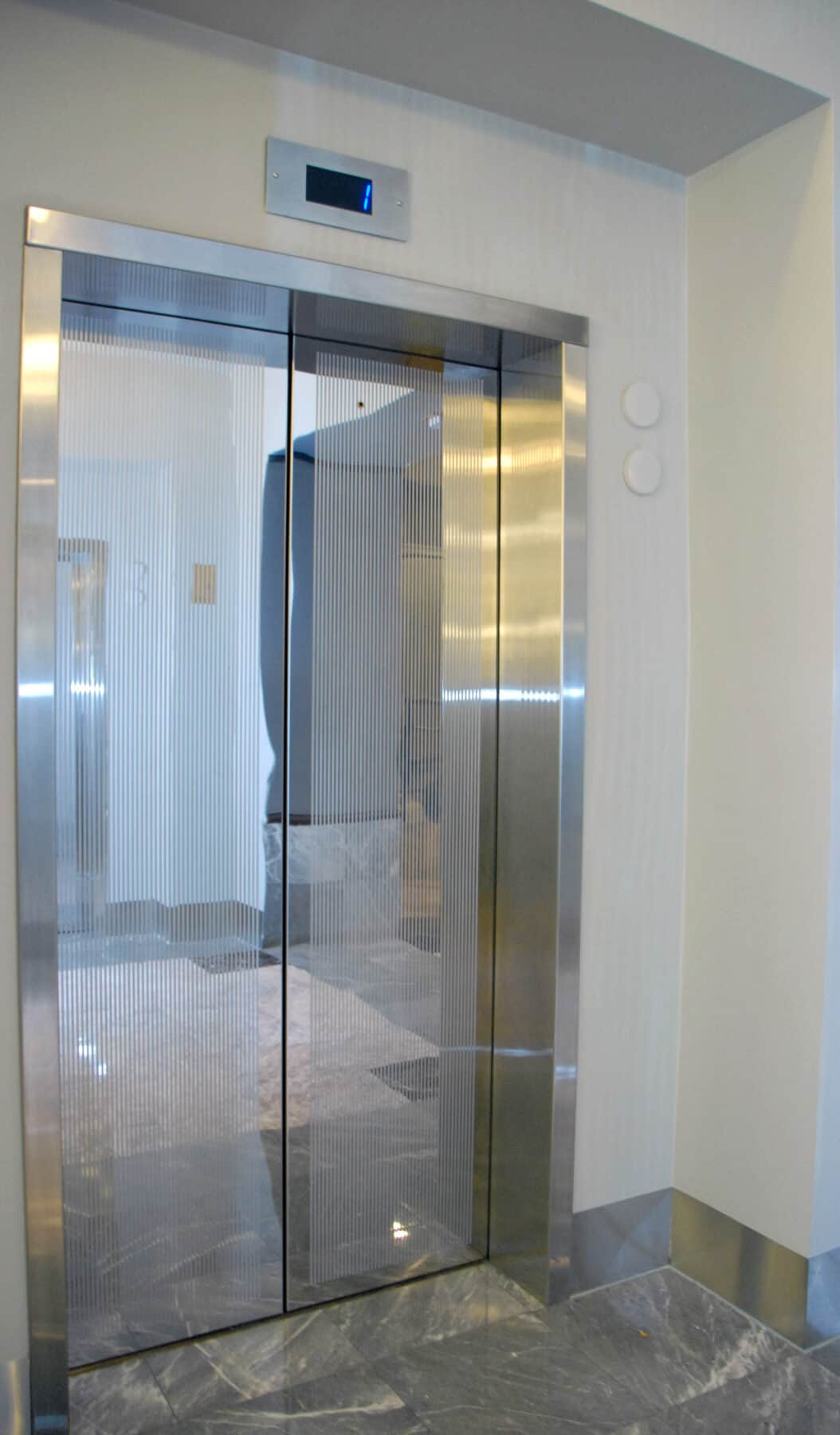 Custom Fabrication of Architectural Metalwork. Specialty Contractors S&E Design Build Featured Project: Etched Elevator Doors