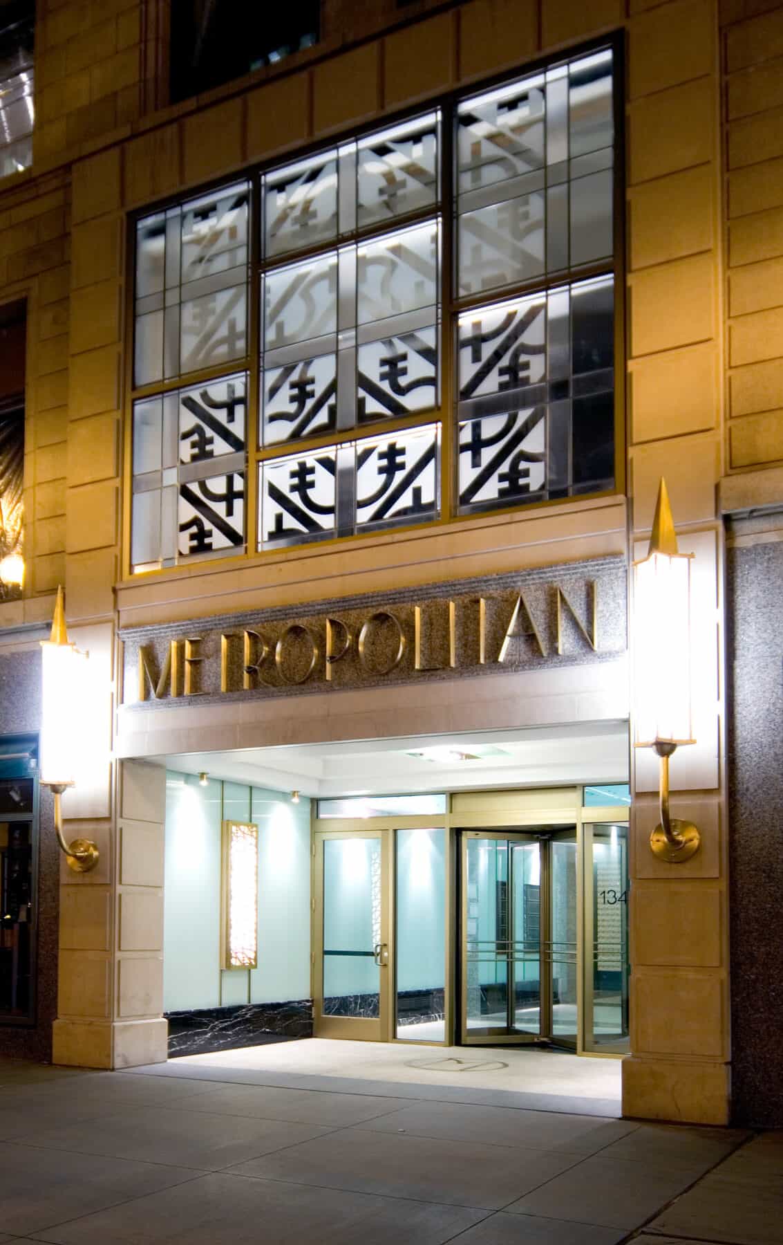 Custom Metal Fabrication of Signage and Entrance of Metropolitan Building from Construction Specialty Projects by Commercial Builder & General Contractor Structural Enterprises