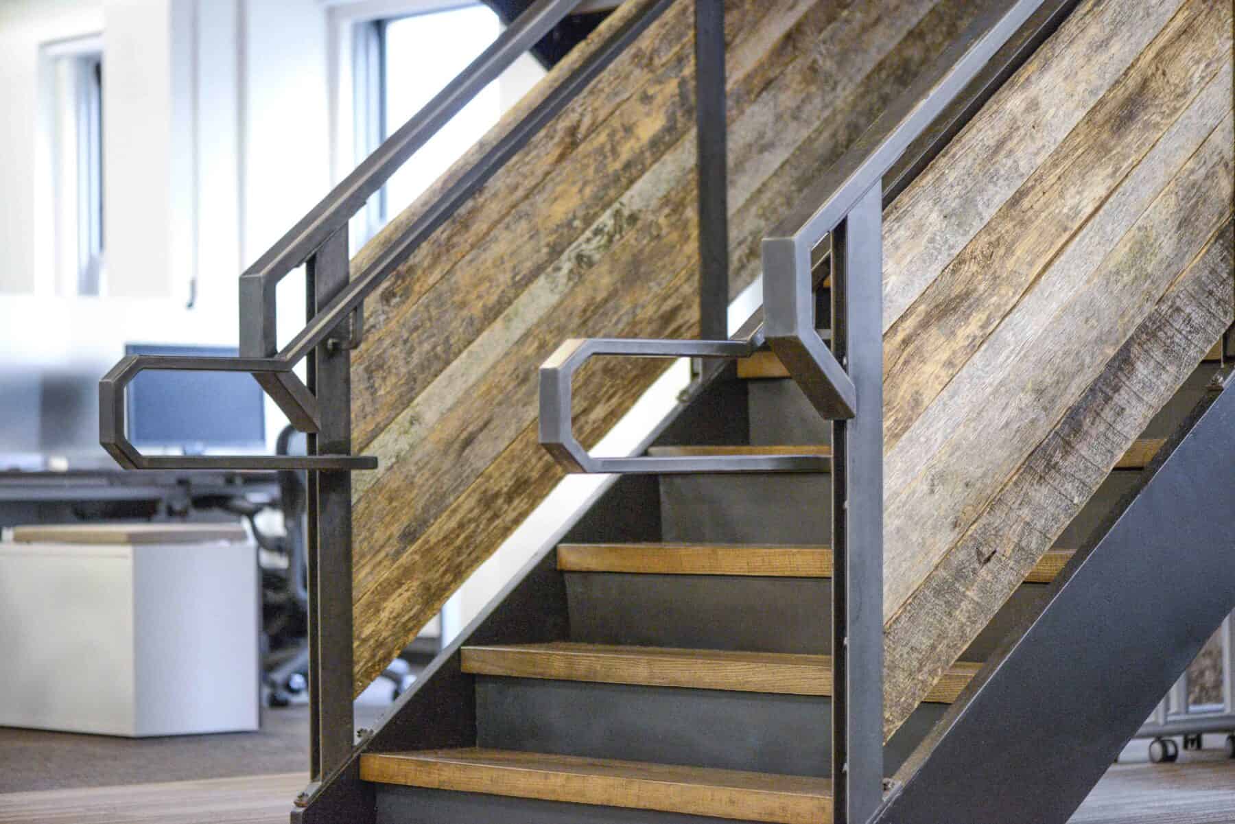 Custom Metal Staircase with Reclaimed Barn wood from Construction Specialty Projects by Commercial Builder & General Contractor Structural Enterprises