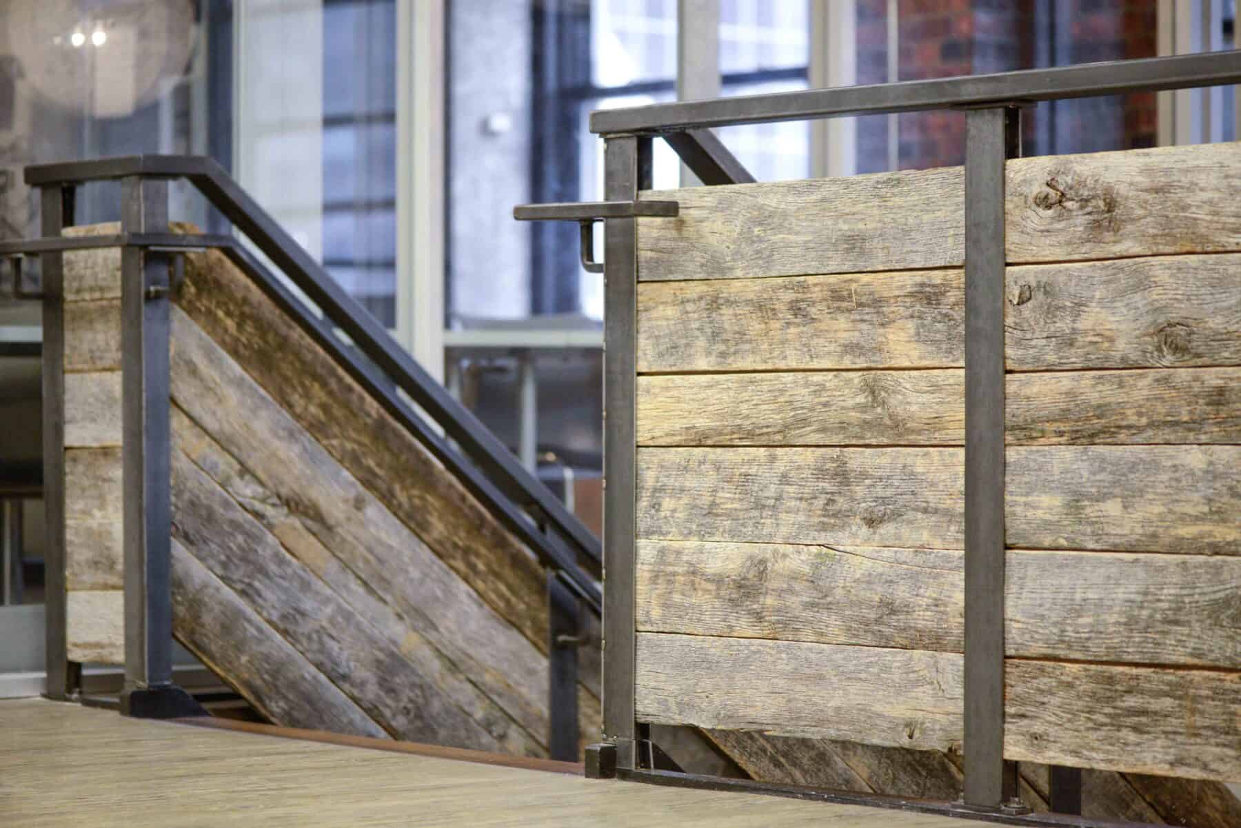 Custom Metal Staircase with Reclaimed Barn wood from Construction Specialty Projects by Commercial Builder & General Contractor Structural Enterprises