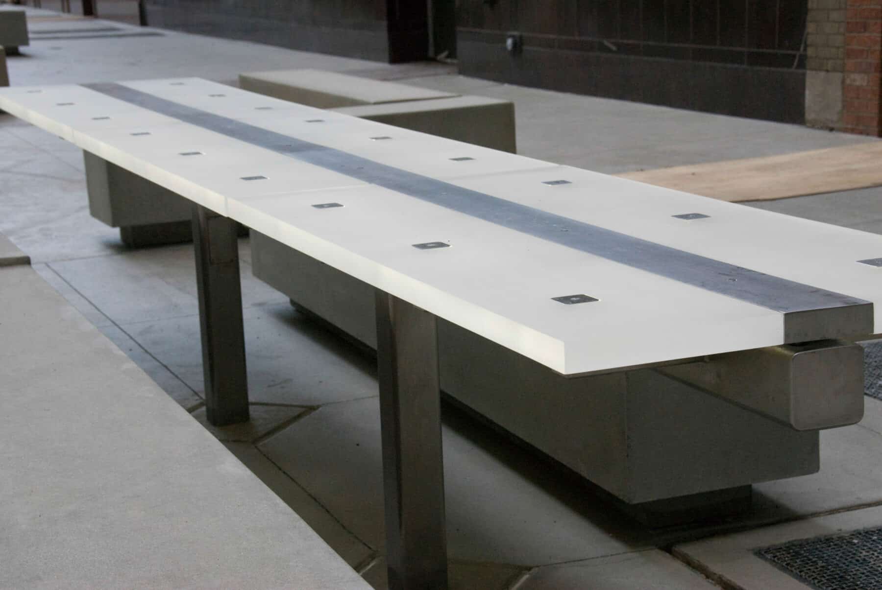 Custom Fabrication of Architectural Acrylic Edge Lit Table with Metal Details from Construction Specialty Projects by Commercial Builder & General Contractor Structural Enterprises
