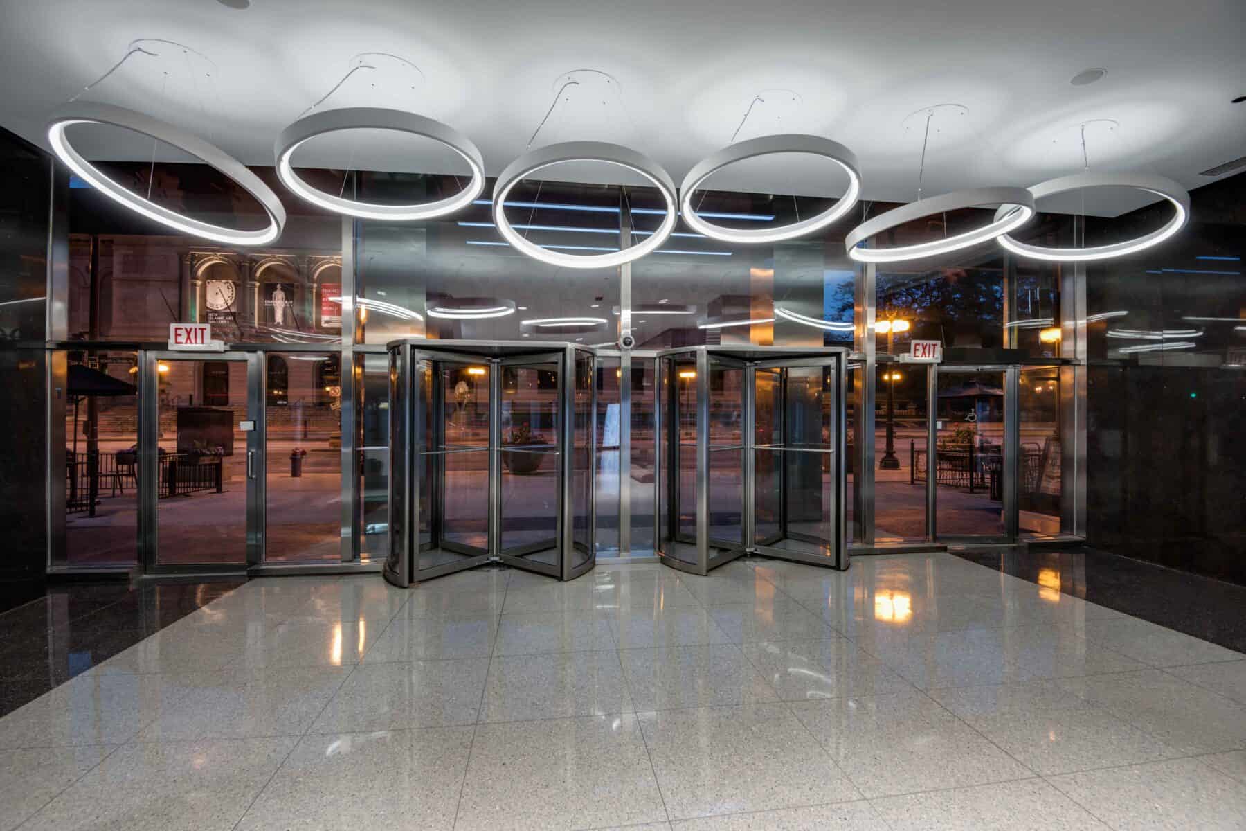 Modern Custom Circular Lights Suspended in Ceiling at Michigan Avenue Lobby by Commercial Builder & General Contractor Structural Enterprises