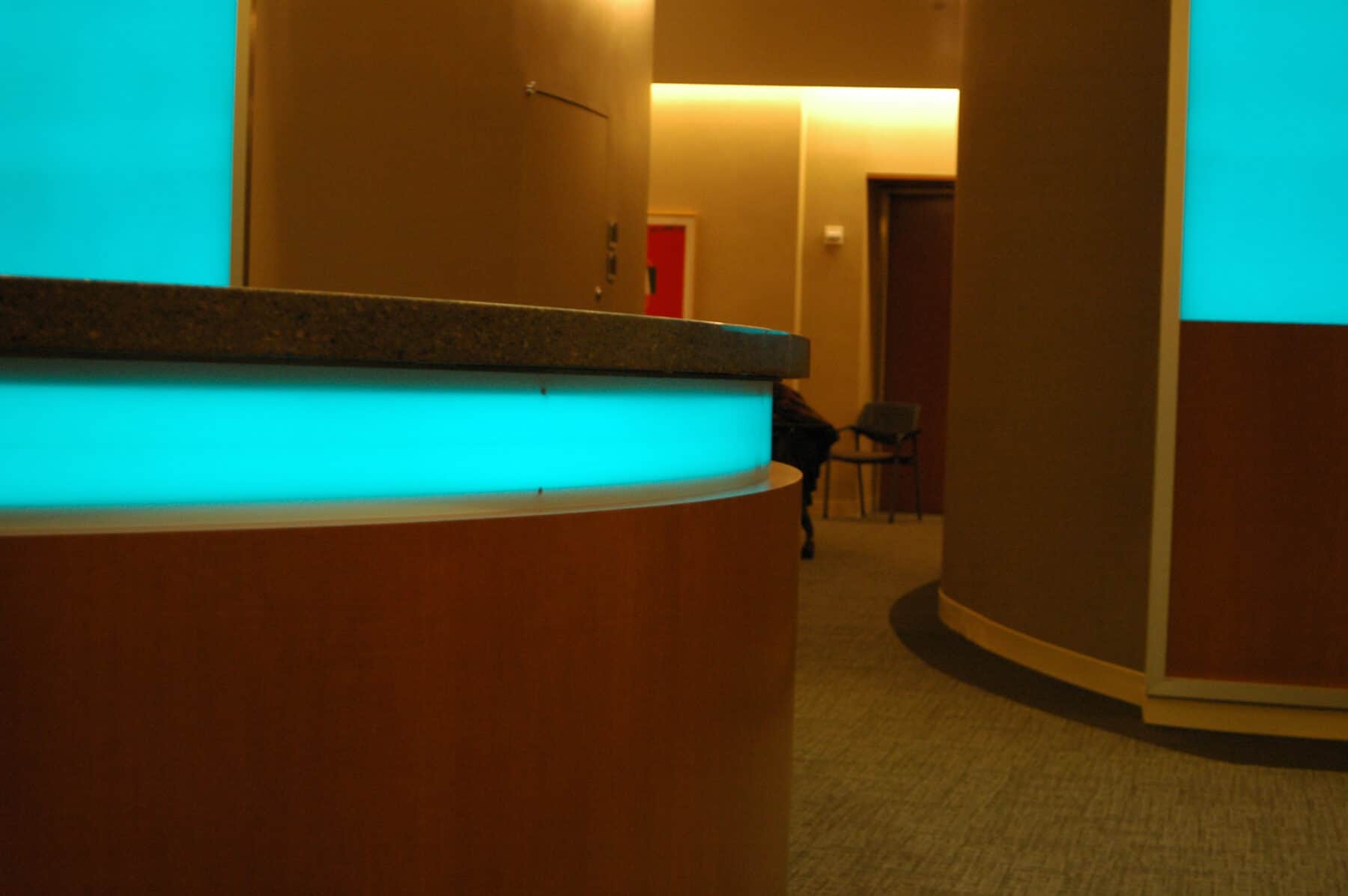 Architectural Backlit Glass Wall Panels and Circular Reception Desk for NBC Universal Studio at Rockefeller Center for Construction Specialty Projects by Commercial Builder & General Contractor Structural Enterprises