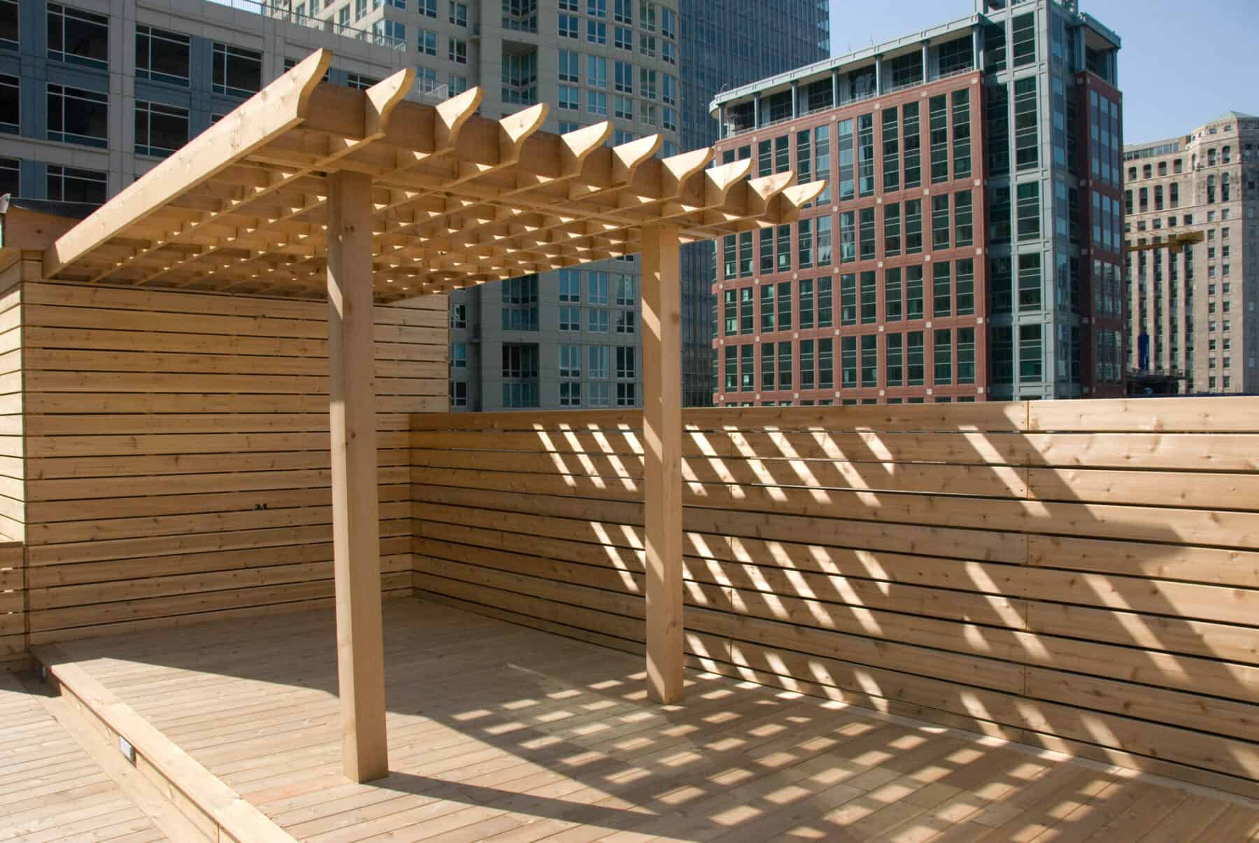 Custom Rooftop Deck with Wood Pergola, Plant boxes, Fence and Walkways from Construction Specialty Projects by Commercial Builder & General Contractor Structural Enterprises