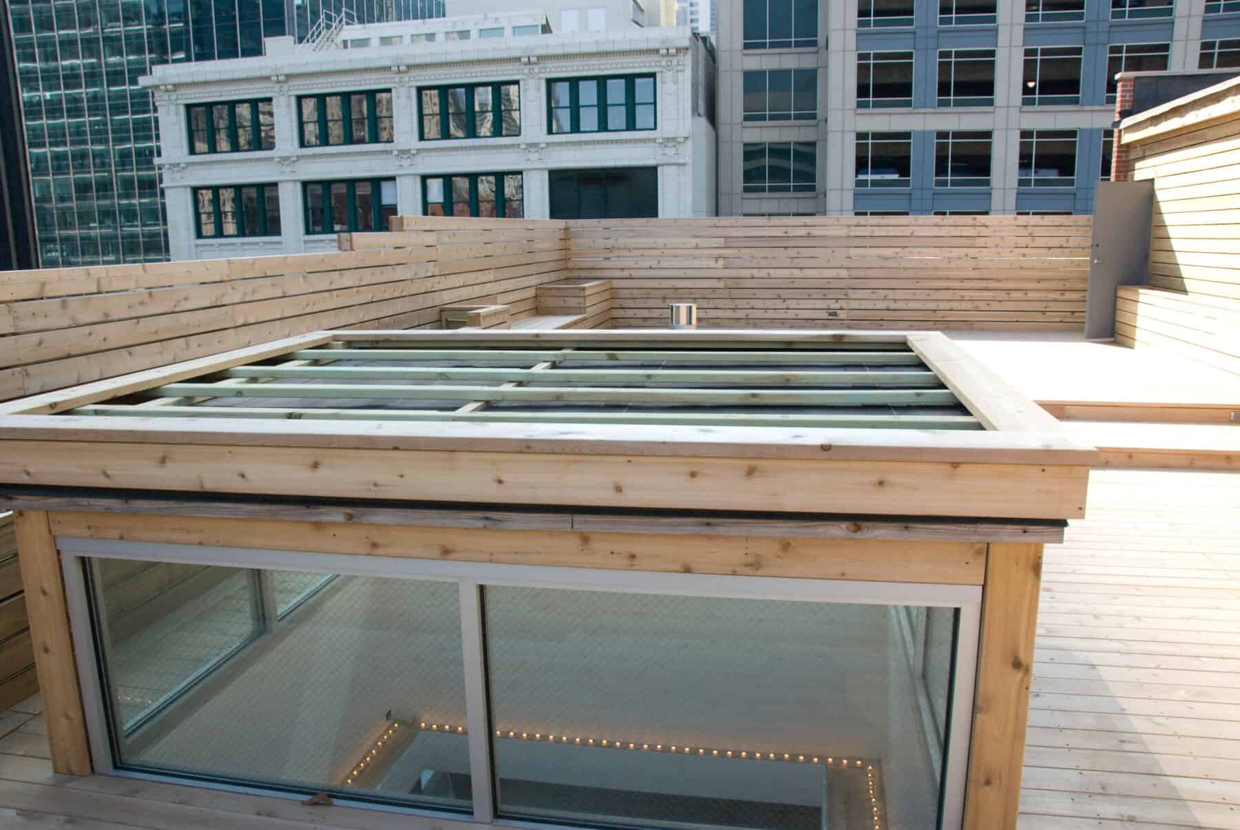 Custom Rooftop Deck with Wood Plant boxes, Skylight, Fence and Walkways from Construction Specialty Projects by Commercial Builder & General Contractor Structural Enterprises