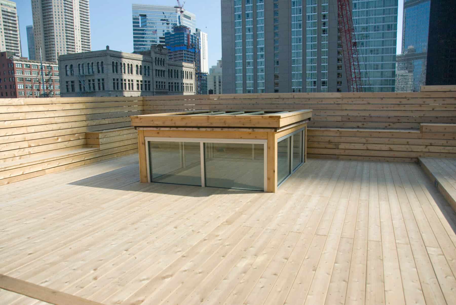 Custom Rooftop Deck with Wood Plant boxes, Skylight, Fence and Walkways from Construction Specialty Projects by Commercial Builder & General Contractor Structural Enterprises