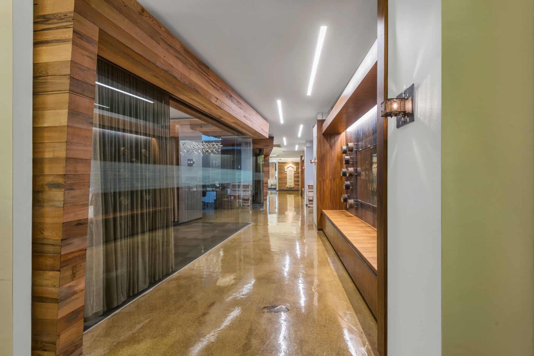 Beautiful Custom Wood Work Repurposed of Original Reclaimed Wood for Sterling Bay Office by Commercial Builder & General Contractor Structural Enterprises