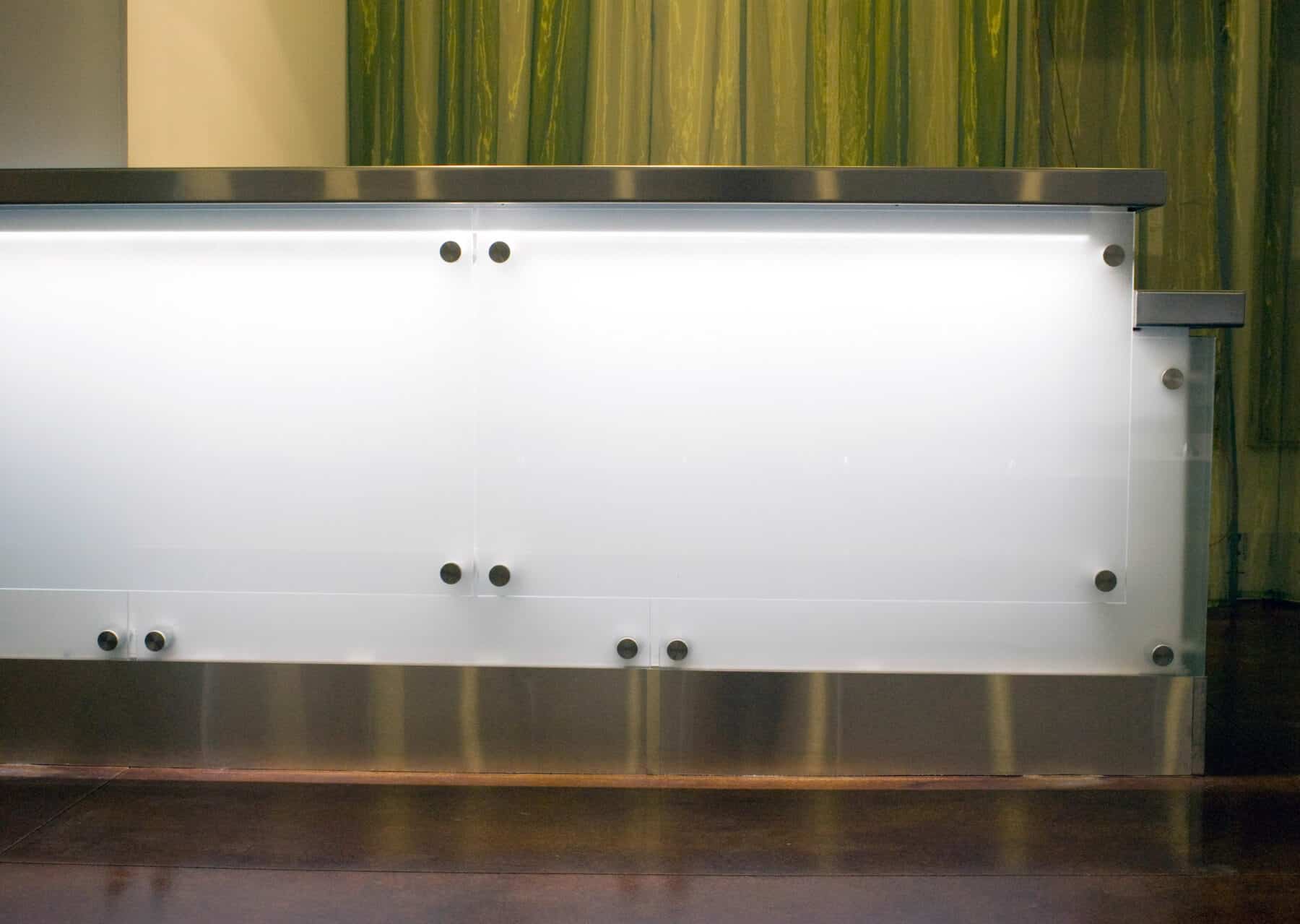Modern Reception Desk with Glass and Metal Details for West Jackson Lobby Remodel by Commercial Builder & General Contractor Structural Enterprises