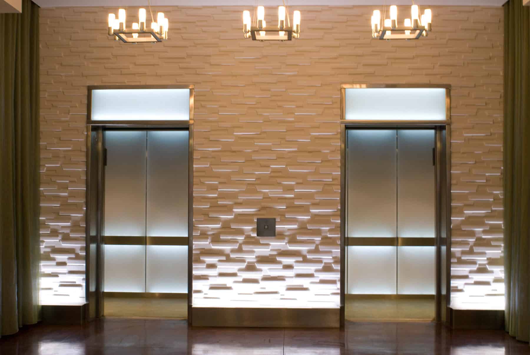 Custom Elevators with Back lit Glass for West Jackson Lobby Remodel by Commercial Builder & General Contractor Structural Enterprises